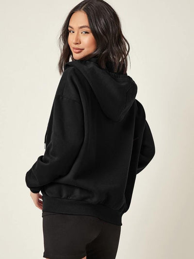 Woman wearing a black hoodie