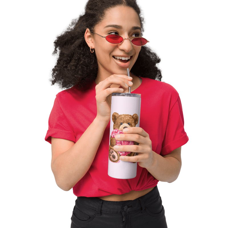 Person wearing a red shirt and sunglasses, holding a tumbler with a bear design.