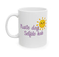 A white ceramic mug with a handle, featuring a cute yellow smiling sun graphic and purple Dutch text that reads 'Nuwe dag Selfde kak' on a clean white background.