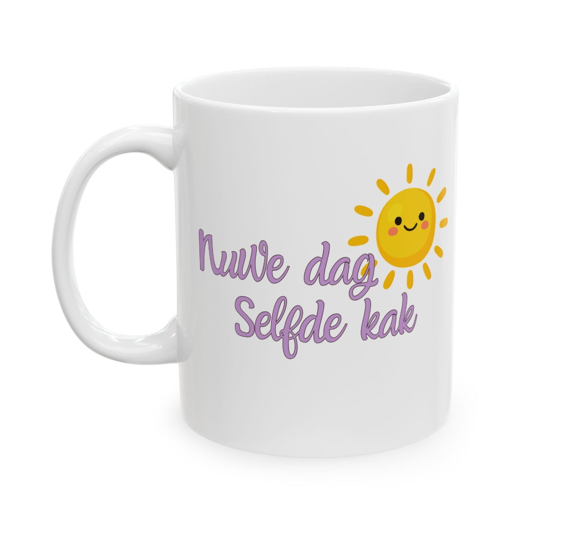 A white ceramic mug with a handle, featuring a cute yellow smiling sun graphic and purple Dutch text that reads 'Nuwe dag Selfde kak' on a clean white background.